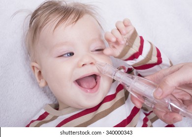 Mother Using Nasal Aspiration For Infant, Mucus Suction