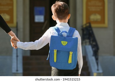 Mother walking her little son to school - Powered by Shutterstock