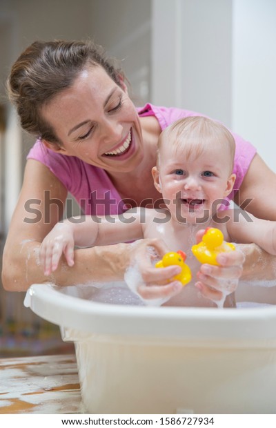 Mother Washing Baby Son Plastic Bath Stock Photo (Edit Now) 1586727934