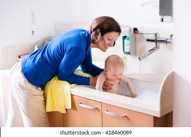 Mother Washing Her Baby In A Hospital Room. Mom Bathing Little Boy During Clinic Stay At Children Station. Health Care And For Young Kids. Parent And Child Stay In Room. Infant Recovery After Sickness