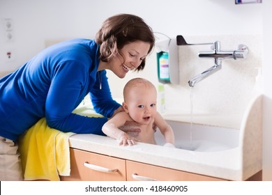 Mother Washing Her Baby In A Hospital Room. Mom Bathing Little Boy During Clinic Stay At Children Station. Health Care And For Young Kids. Parent And Child Stay In Room. Infant Recovery After Sickness