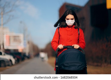 Mother Wearing Face Mask Walking Baby In Stroller. Mom With Baby Pram During Pandemic Taking A Walk Outdoors
