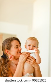 Mother Wiping Baby After Feeding