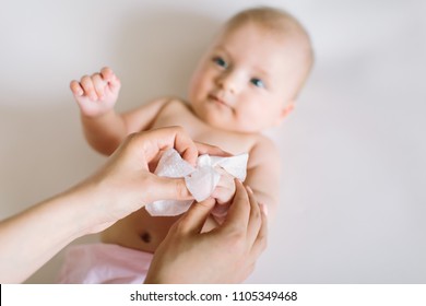 Mother Wiping Baby's hands