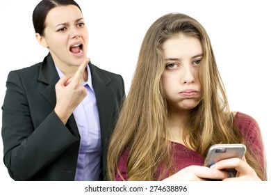 Mother yelling at daughter with phone
