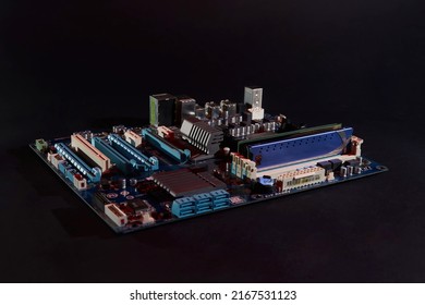 Motherboard from a computer on a black background