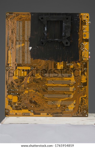 Motherboard computer pc fixed.\
Basic color yellow. Spare parts of a computer. Technology and\
future.