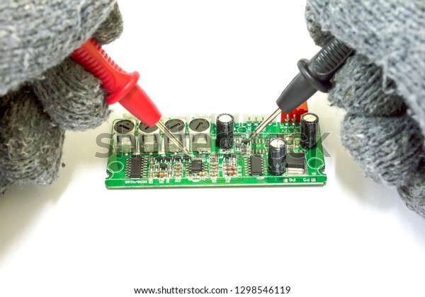 Motherboard of parking system unit Repair on\
white background, Car\
accessories.