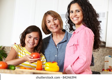 Mother,daughter And Grandmother Cooking