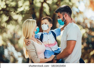 Mother,father and little son wearing face protective medical mask for protection from virus disease in park. - Powered by Shutterstock