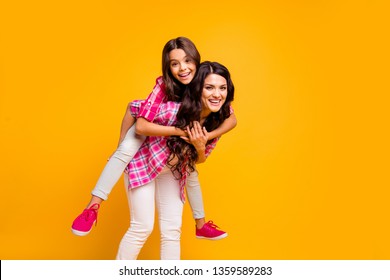 Motherhood Parenthood Concept. Portrait Of Charming Cute Mom Little Kid Have Free Time Funky Walk Stroll Feel Satisfied Playful Carefree Dressed Colorful Stylish Outfit Isolated Yellow Background