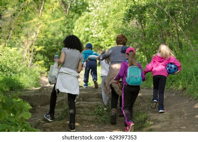 Mothers with children on the walk in forest, walk through forest in spring for your health