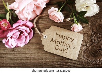 Mothers day card with rustic roses on wooden board - Shutterstock ID 183118241