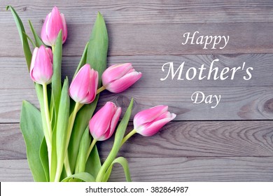 Mothers Day Card With Tulips. Pink Flowers With Text On Wooden Background. 