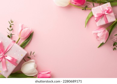 Mother's Day decorations concept. Top view photo of trendy gift boxes with ribbon bows and tulips on isolated pastel pink background with copyspace - Shutterstock ID 2280689171