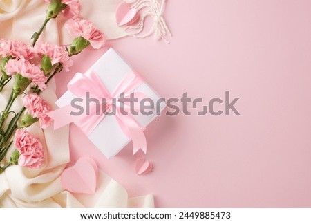 Mother's day elegance: white gift box with pink ribbon among carnations on a pastel background