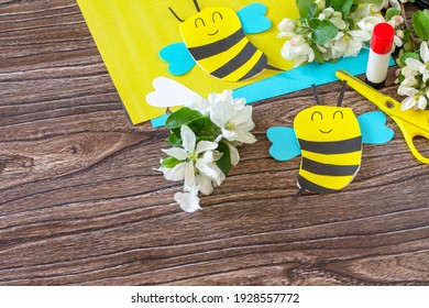 Mother's Day Greeting Card Gift - Bee With Spring Apple Tree Flowers On A Wooden Table. Childrens Creativity Project, Handmade, Crafts For Kids. Copy Space.