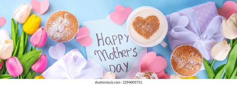 Mother's day holiday greeting card. Mother's Day morning breakfast with a cute surprise background, with gift boxes, cupcakes, coffee mug, heart decor, tulips and flowers, Happy Mother's Day letter - Powered by Shutterstock