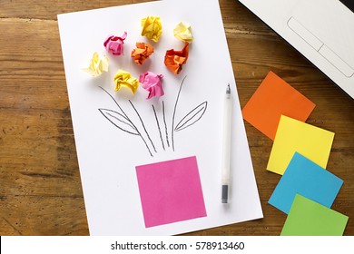 Mother's Day Present: White Office Sheet Of Paper With Colorful Small Papers, Representations Of Flowers For Holidays