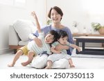 Mothers enjoying raising siblings Image of parenting and childcare　looking at a camera