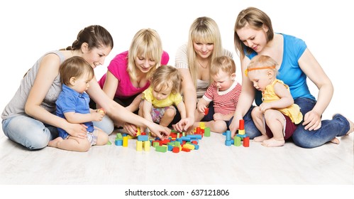 Mothers And Kids Group Playing Toys, Mother With Baby Play Building Blocks Over White Background