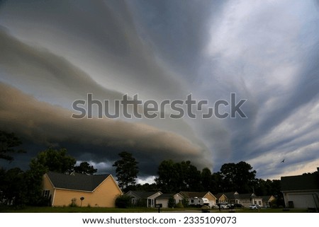 Mothership (Shelf Cloud) over suburban neighborhood.  Severe Weather. 
