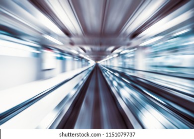 Motion Blur Abstract Background, Fast Moving Walkway Or Travelator In Airport Terminal Transit, Zoom Effect, Center Diminishing Perspective. Transportation, Warp Speed, Or Business Technology Concept