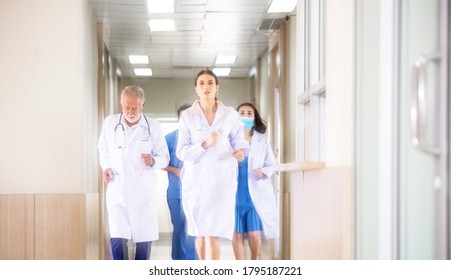 Motion blur background group of doctor and medical team running rushing to the rescue center hallway in hospital. emergency to saving patient life. health care concept  - Powered by Shutterstock