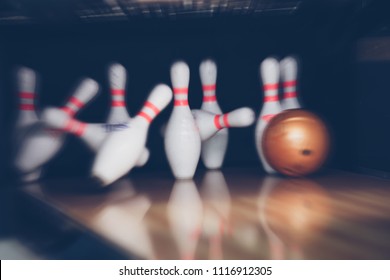 motion blur of bowling ball and skittles on the playing field