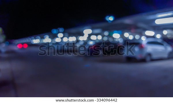 Motion blur car\
and defocus car park with\
bokeh