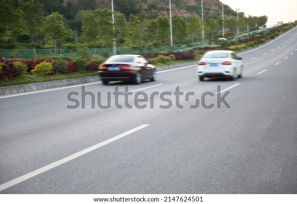 Motion blur of  car\
driving on  Asphalt road