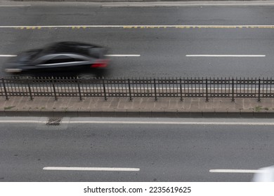Motion blur of the car on the four lane road. Transportation background photo.