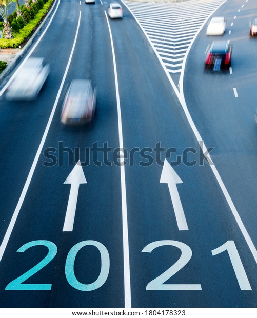 Motion\
blur of car traffic on the road with number\
2021