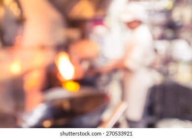 Motion Blur Chefs Of A Restaurant Kitchen