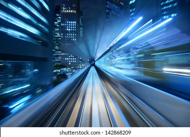 Motion Blur Of A City And Tunnel From Inside A Moving Monorail In Tokyo.