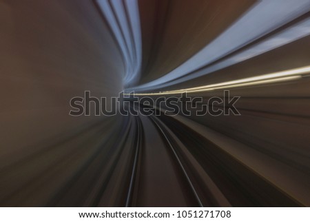 Motion blur / effect of MRT (Mass Rapid Transit) train moving fast inside tunnel. MRT is a transportation for future generation.