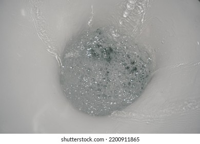 Motion Blur Of Flushing Water In Toilet Bowl. Toilet Bowl Flush. Selective Focus Of Flushing Water In Ceramic Toilet.
