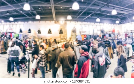 Motion Blur Long Line Of Diverse Customers Waiting To Checkout At Activewear, Outdoor Gear Store In Texas, USA. Defocused Abstract Crowed People Retractable Stanchions Queue Barrier, Holiday Shopping