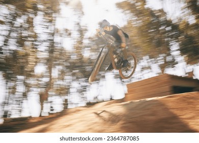 Motion blur, mountain bike and cycling, man with speed for extreme sports and training in fast adventure. Professional dirt race action, off road bicycle competition or performance challenge in woods - Shutterstock ID 2364787085