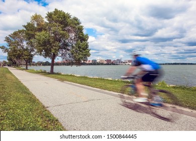 Motion Blur Of A Person Riding A Bicycle On The Bike Path In Madison, Wisconsin