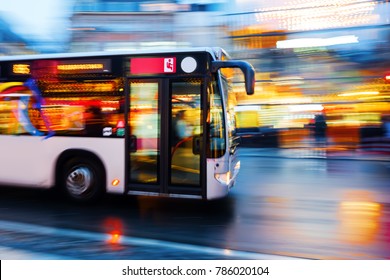 Motion Blur Picture Of A Driving Bus In The City At Night