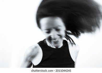 Motion Blur Portrait Of Woman Over 40. Black Tshirt