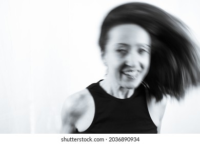 Motion Blur Portrait Of Woman Over 40. Black Tshirt