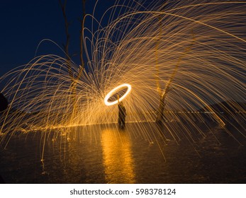 Motion blur of process the man making steel wool.