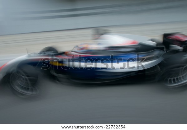 Motion blur of sports car at motorsports
championship race.