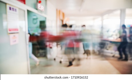 Motion Blur Stretcher Patient to Emergency Room in Hospital, Blurred Hospital background, Unrecognized Doctors and nurses are urgently helping emergency accident patients.