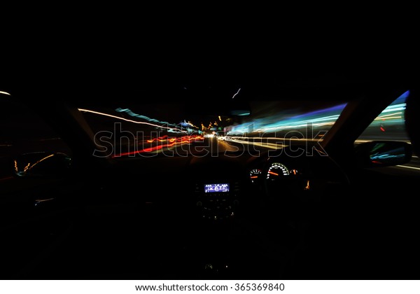 motion blur  of the\
vehicle and light