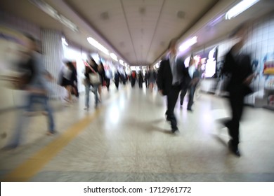 Motion blur of walking people. People on the way to work, rushing through the underground tunnel. Seoul, South Korea