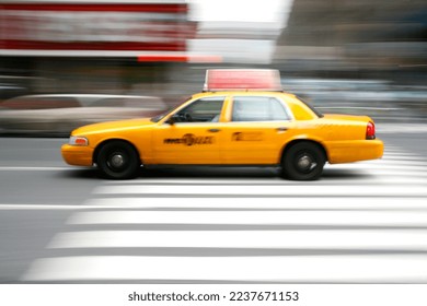 Motion blur of yellow taxi in New York City.