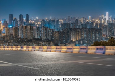 motion blurred asphalt road with modern cityscape at night. - Shutterstock ID 1815649595